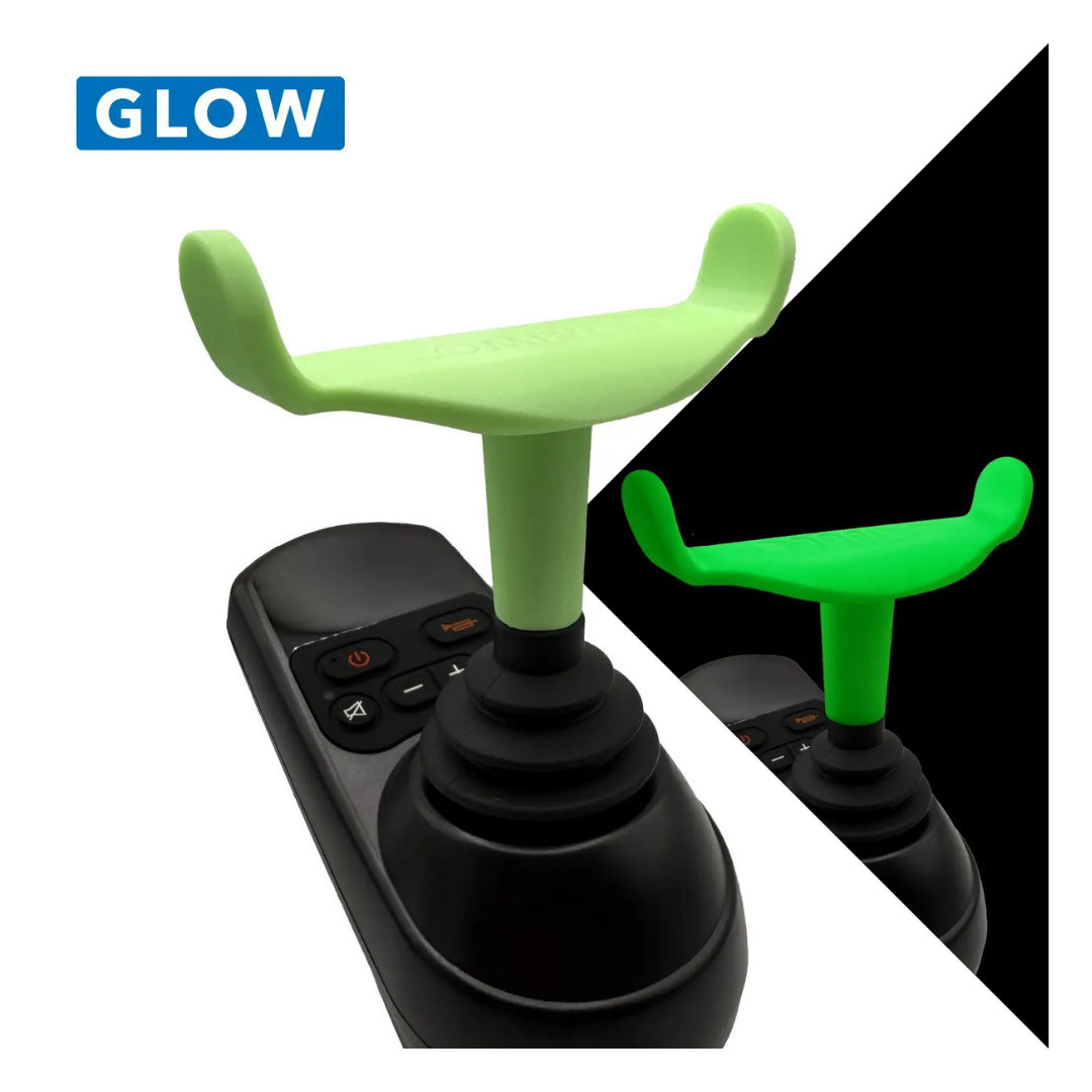 The ComfyGo Ergonomic U-Shaped Joystick Handle with Flex Shaft for Powerchairs is shown in black with a green, glow-in-the-dark T-shaped attachment. A close-up and inset image highlight its luminous effect in the dark.